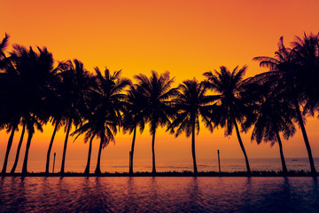Fototapeta na wymiar Sunset with silhouette Palm trees .