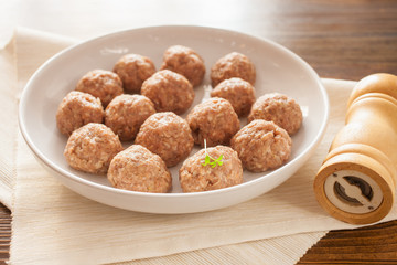 meatballs in ware for roasting, selective focus