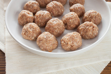 meatballs in ware for roasting, selective focus