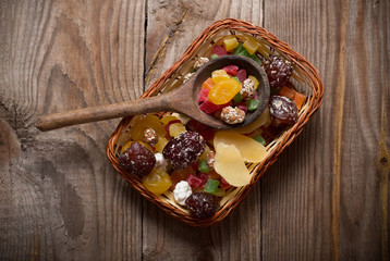 Fototapeta na wymiar dried fruits mix on wooden background