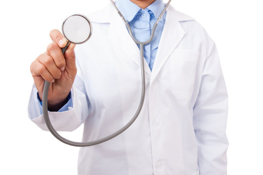 Doctor with a stethoscope in the hands on white background