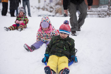 Fototapeta na wymiar group of kids having fun and play together in fresh snow
