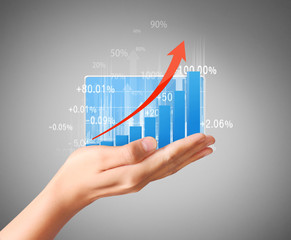 nvestment concept with financial chart symbols coming from hand