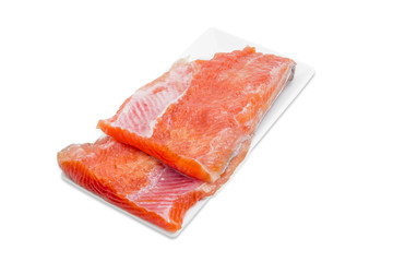 Uncooked fillet of rainbow trout on a rectangular dish