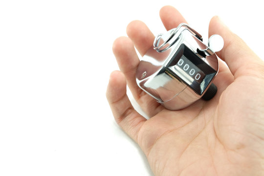 number 0000 (selected focus) shown in number counter on hand wit