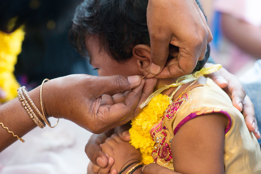 Baby Girl In Ear Piercing Ceremony