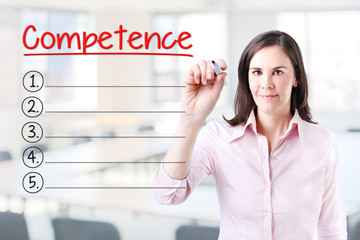 Business woman writing blank Competence list. Office background. 