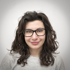 Fototapeta premium Smiling girl with glasses