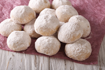 shortbread polvorón closeup on a wooden table. horizontal