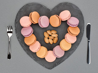 Still life, macarons, heart shape. Table setting