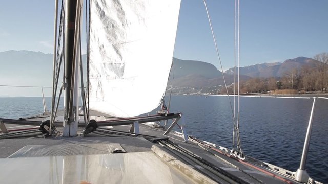 Sailboat sailing in calm lake