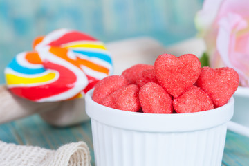 heart candies coated with sugar in white cup.selective focus.