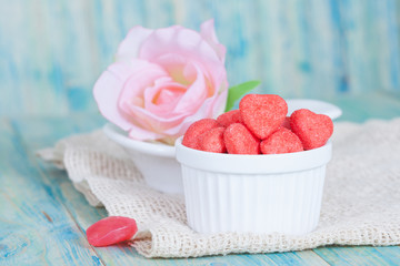 heart candies coated with sugar in white cup.selective focus.