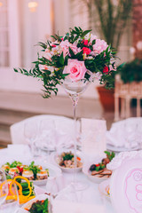 Table set for an event party or wedding reception, spring theme