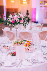 Table set for an event party or wedding reception, spring theme