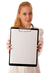 Woman doctor with stethoscope around neck showing clipboard with