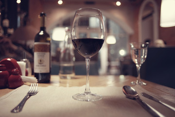 glass of wine, a restaurant serving a blurred background