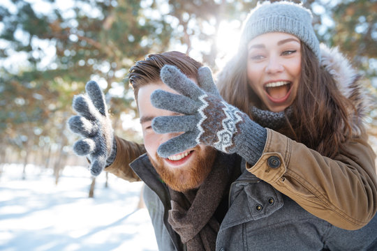 Couple having fun in winter park
