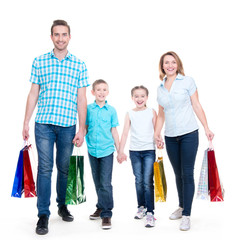 Obraz premium Happy american family with children holding shopping bags