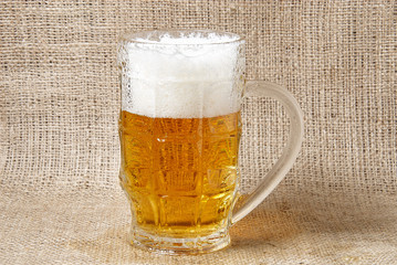 Glass of  beer on a burlap background