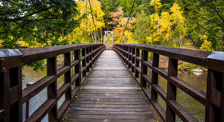 Autumn Hike In Michigan On The North Country Trail. Bridge over the Black River in the Ottawa National Forest on the North Country Trail in Michigan.