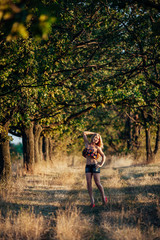 Fototapeta premium Portrait of blonde girl in the field