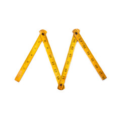 Vintage measuring carpentry ruler. wooden texture and yellow color. white background, copytext, copy space