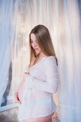 Fototapeta premium Portrait of beautiful pregnant woman