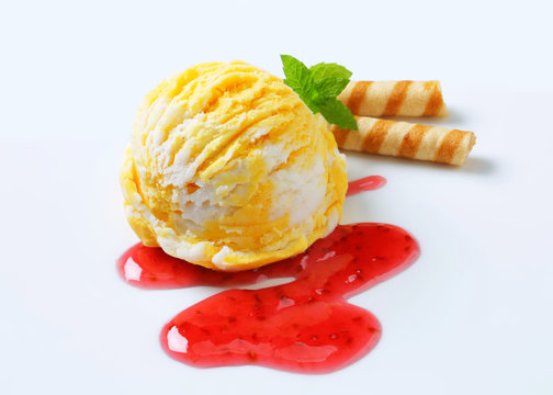 Fruit ice cream with raspberry sauce