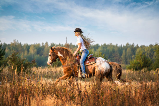 Girl riding on the Appaloosa horse