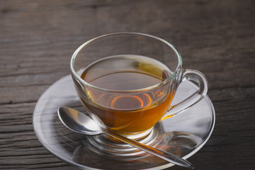 Hot tea cup on old wooden