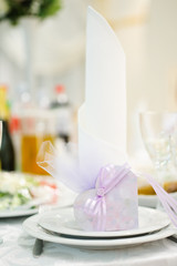 Obraz na płótnie Canvas Banquet wedding invitation on table setting on evening reception