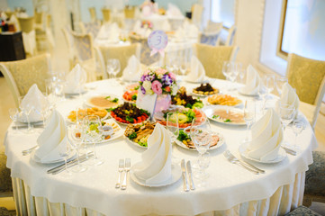 Banquet wedding table setting on evening reception