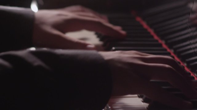 Piano music pianist hands playing. Musical instrument grand piano details.