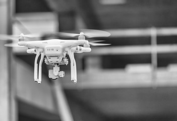 Industrial drone surveying construction site - obrazy, fototapety, plakaty