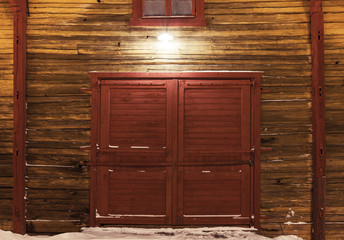 Obraz na płótnie Canvas Old wooden gate of warehouse with spotlight