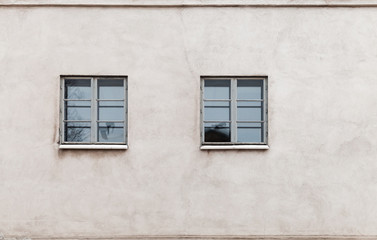 Fototapeta na wymiar Two windows in modern gray concrete wall