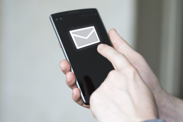 Businessman pressing virtual icon messaging mail sending