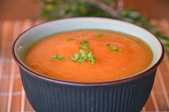 Pumpkin Creme Soup In The Bowl With Parsley   