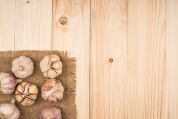 Garlic on wooden background