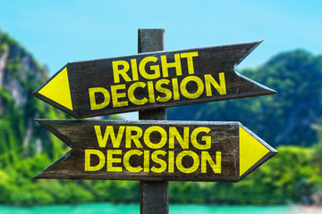 Right Decision - Wrong Decision signpost in a beach background