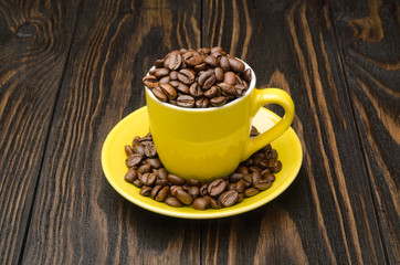 Coffee Beans in a Yellow Cup