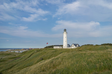 Fototapeta na wymiar Beautiful landscape of Hirtshals with lighthouse in frornt. Denmark.