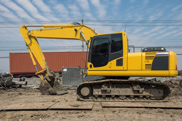 Big excavator on new construction site