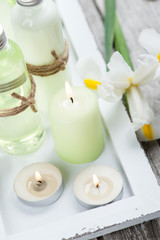 Fototapeta na wymiar Bath products, candles, wooden background
