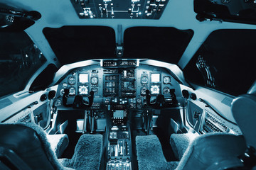 Aircraft interior, cockpit view inside the airliner - obrazy, fototapety, plakaty