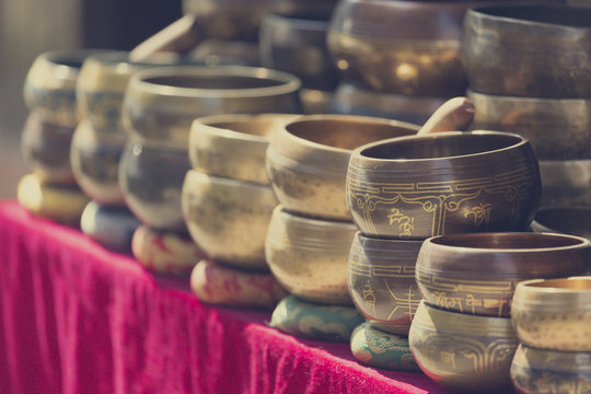 Several singing bowls displayed at a market in Kathmandu, Nepal