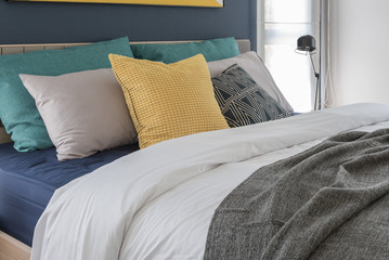 modern bedroom with colorful pillows