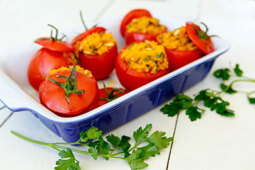 Stuffed tomatoes with sweet potato mash, pine nuts, parsley