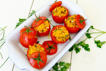 Stuffed tomatoes with sweet potato mash, pine nuts, parsley
